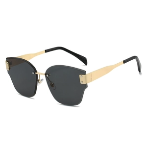 Fashionable rimless cat-eye sunglasses with gold metal frame and dark grey lenses