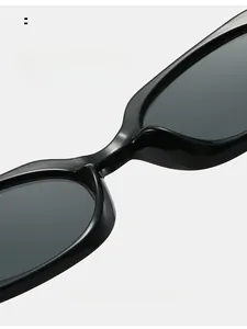 Detail view of comfortable integrated nose pads on black rectangular sunglasses