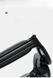Macro view of lightweight flexible hinges and glossy black arms of retro sunglasses