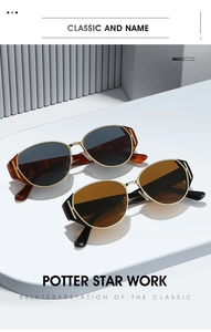 Detail of retro cat-eye sunglasses with tortoise frame and gold metal hinges
