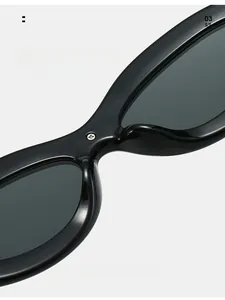 Detail of integrated nose pads on black retro sunglasses with metal screw accents