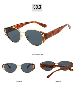 Detail view of tortoiseshell cat-eye sunglasses with H-shaped metal accent and gold bridge