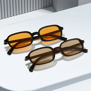 Retro narrow frame sunglasses in black with orange lenses and translucent brown finish