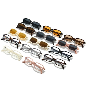 Multiple vintage narrow rectangular sunglasses and clear frame glasses in various colors