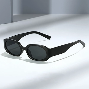 Fashionable black oval sunglasses with thick frames and retro dark lenses in 2025 style