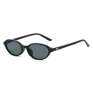 Retro oval black frame sunglasses with heart-shaped metal trim and dark grey lenses