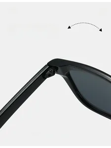Detail of durable texture hinge on black oversized square sunglasses for long-lasting use