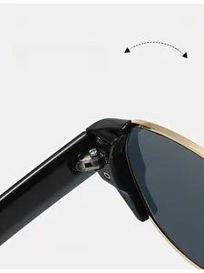 Close-up of durable metal hinge on retro cat eye sunglasses with black and gold frame