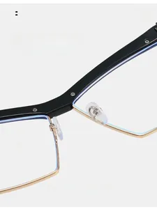 Detail of adjustable silicone nose pads on black and gold cat-eye glasses for comfort