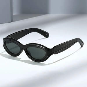 Modern oval chunky sunglasses in solid black with wide frame and dark grey lenses