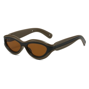 Retro cat-eye sunglasses with olive green and black color-block frames and dark lenses