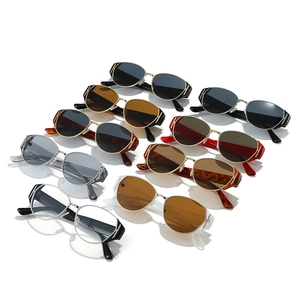 Flat lay of cat-eye sunglasses collection with various frame colors and metallic hollow details