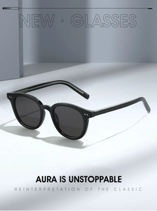 Macro shot of retro black acetate thick-frame sunglasses with silver rivet detail