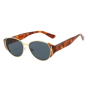 Retro cat-eye sunglasses with gold metal frame and tortoiseshell acetate temples