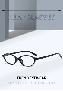 Minimalist vintage small oval glasses frame in polished black finish on a sleek background
