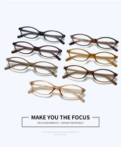 Flat lay of retro oval eyeglass frames in multiple colors with polished metal hinges