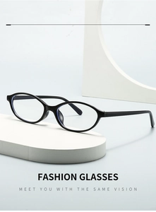 Detail view of oval black frame glasses displayed on a minimalist geometric white stand