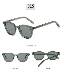 Three-way display of dark green transparent retro sunglasses with dark gray lenses