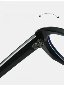 Detailed macro view of durable metal hinges on black acetate fashion eyeglass frames