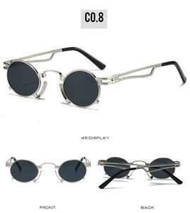 Detailed views of vintage round silver metal sunglasses with geometric hollow temples