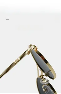Detail of gold metal sunglasses frame with non-slip texture and silicone nose pads