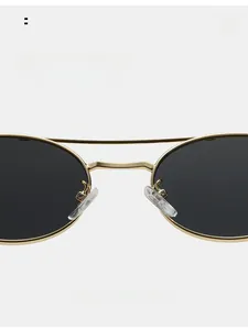 Detail of adjustable silicone nose pads on vintage metal double bridge sunglasses