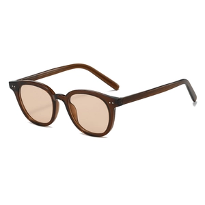 Vintage tortoiseshell sunglasses with brown translucent lenses and silver rivets in 45-degree view