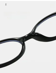 Close-up of comfortable integrated nose pads on black oval eyeglasses frames
