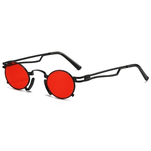 Vintage round sunglasses with red lenses and black metal frames for a steampunk look