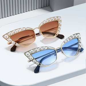 Chic cat eye sunglasses with pearl-embellished gold frames and gradient lenses