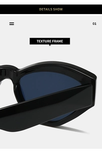 Detail showing the glossy texture and thick frame design of black cat-eye sunglasses