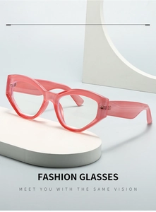 Close-up of pink translucent cat-eye frame glasses on a modern geometric display
