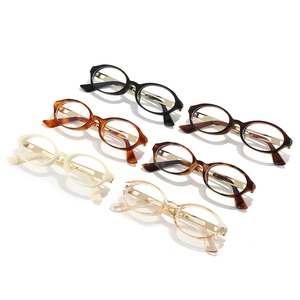Oval anti-blue light glasses frames in champagne and tortoiseshell colors shown in a group view