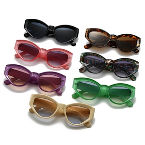 Collection of retro cat-eye sunglasses in various colors on a white background
