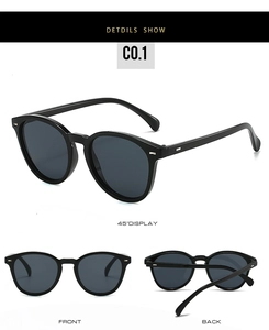 Detailed views of vintage oval sunglasses with black frames and metal side accents