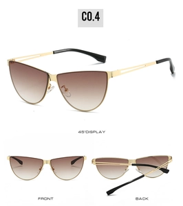 Cat eye sunglasses detail with gold metal frame, brown gradient lenses and nose pads