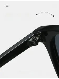 Detail of durable texture hinge on black oval sunglasses showing robust metal components