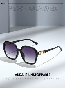 Close-up of square sunglasses with purple gradient lenses and gold metal hollow temple detail