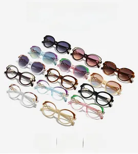 Detail of vintage oval sunglasses showing hollow metal braided temples and varied colors