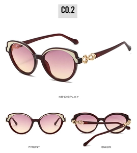 Three-way view of cat eye sunglasses with burgundy frame and golden chain detail