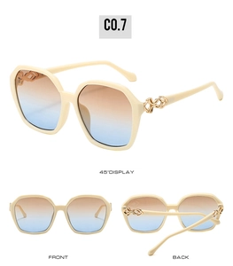 Detailed view of cream square sunglasses featuring gold twist temples and gradient lenses