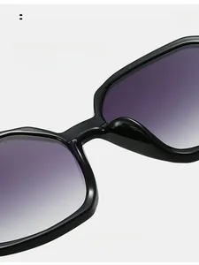 Detail of comfortable integrated nose pads on black square frame sunglasses with purple lens