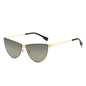 Fashionable gold metal cat-eye sunglasses for women with gradient grey lenses on white
