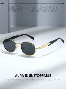 Detail of gold metal oval sunglasses with dark lenses and geometric temple design