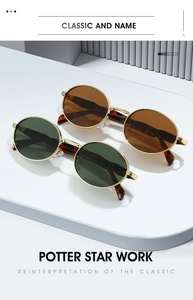 Detailed macro view of oval gold metal frame sunglasses with tortoiseshell temple tips
