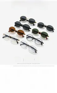 Detail view of oval metal sunglasses collection featuring UV400 lenses and sleek frames