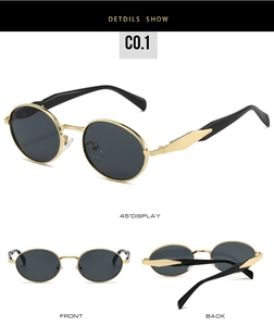 Detail view of oval metal sunglasses with gold frames and wide black temples
