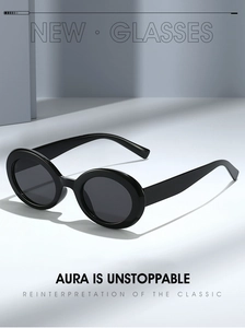 Close-up of polished black oval sunglasses frame showing sleek texture and high-end finish