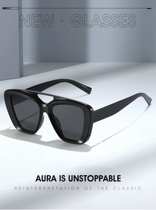 Detail of black thick frame sunglasses with double bridge design and geometric shadow