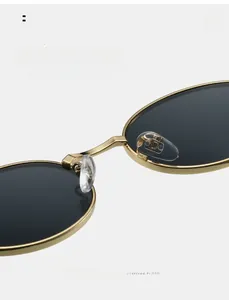 Close-up of comfortable silicone nose pads on gold metal oval frame sunglasses